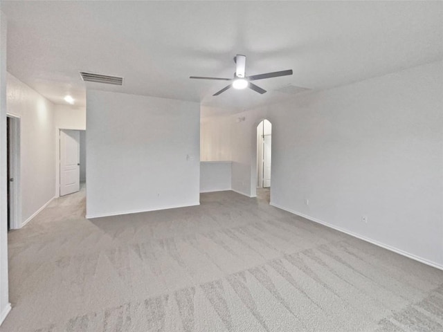 19500 Morgana Dr, Pflugerville, TX 78660 - unfurnished living room with ceiling fan, arched walkways, carpet, and baseboards