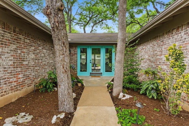 8702 Willowick Dr, Austin, TX 78759 - property entrance featuring french doors and brick siding
