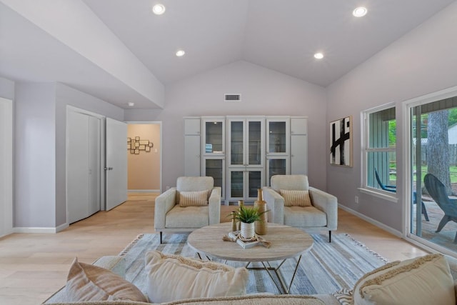 8702 Willowick Dr, Austin, TX 78759 - living area with light wood-type flooring, recessed lighting, and high vaulted ceiling