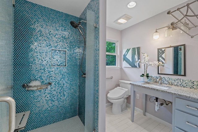 8702 Willowick Dr, Austin, TX 78759 - full bathroom with a tile shower, tile patterned flooring, vanity, and decorative backsplash