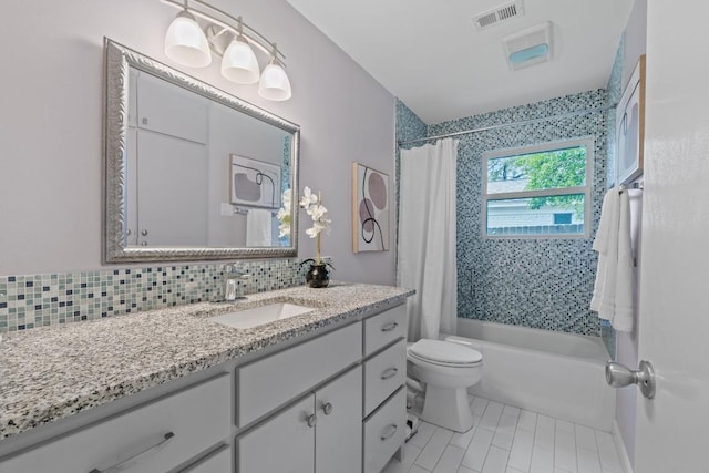 8702 Willowick Dr, Austin, TX 78759 - bathroom with vanity, shower / tub combo with curtain, tile patterned floors, and tasteful backsplash
