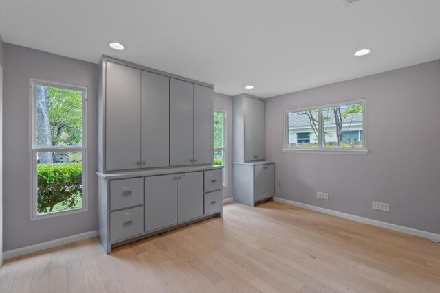 8702 Willowick Dr, Austin, TX 78759 - unfurnished bedroom featuring light wood-style floors and recessed lighting