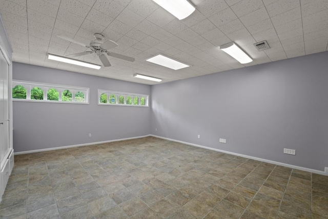 8702 Willowick Dr, Austin, TX 78759 - empty room with ceiling fan and baseboards