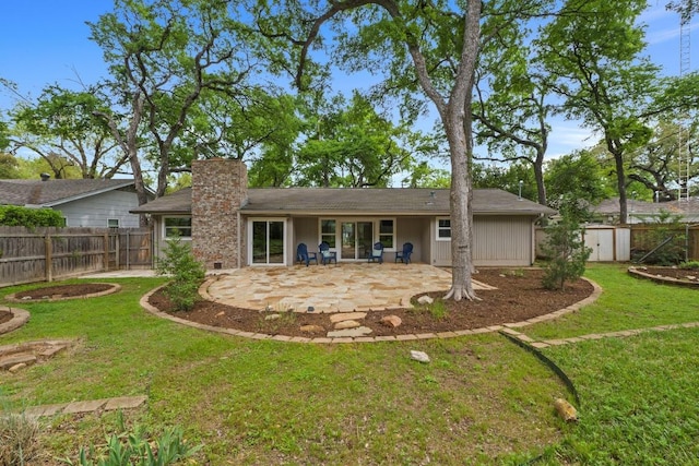 8702 Willowick Dr, Austin, TX 78759 - rear view of house with a patio area, a chimney, and a fenced backyard