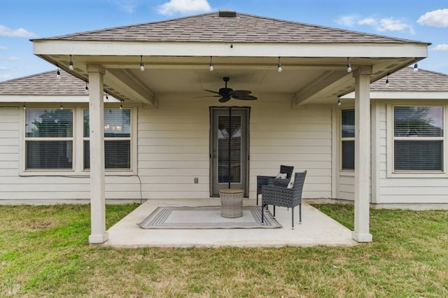 113 Tailwind Dr, Kyle, TX 78640 - back of property with a ceiling fan, a shingled roof, a yard, and a patio area