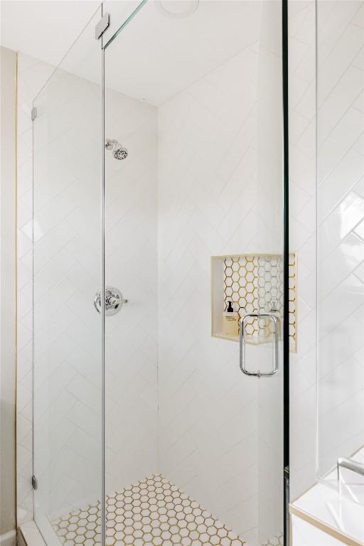 full bath featuring a shower stall