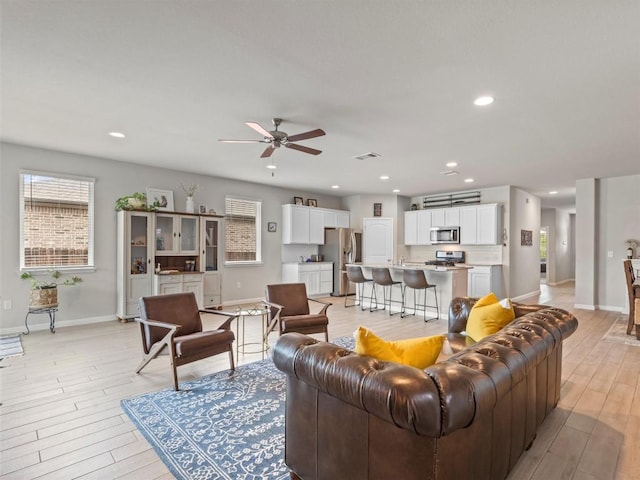 4104 Porter Farm Rd, Georgetown, TX 78628 - living area featuring a ceiling fan, healthy amount of natural light, light wood-style flooring, and recessed lighting