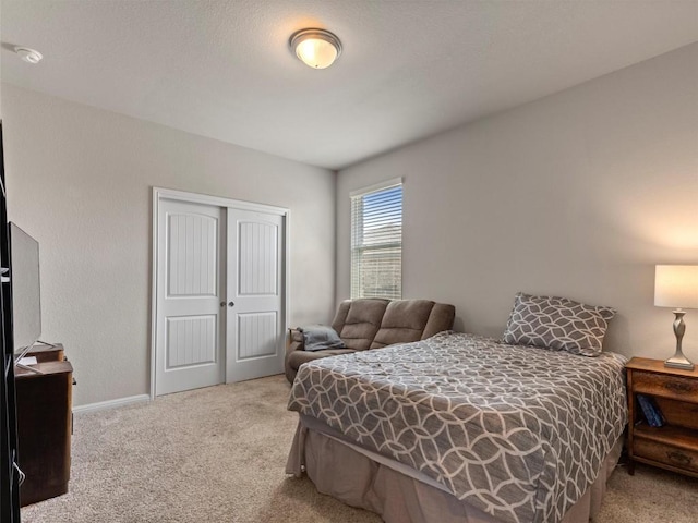 4104 Porter Farm Rd, Georgetown, TX 78628 - bedroom with baseboards, a closet, and carpet floors