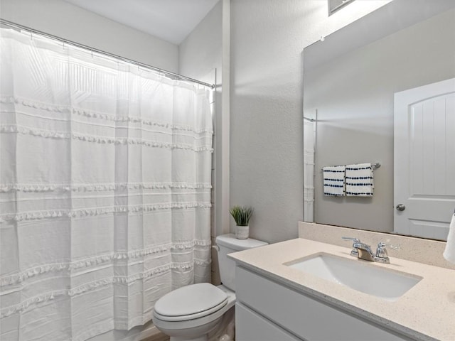 4104 Porter Farm Rd, Georgetown, TX 78628 - full bathroom with toilet, a shower with shower curtain, and vanity