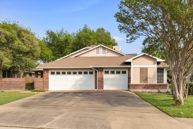 12301 Furrow Cv Unit B, Austin, TX 78753 - view of front of property featuring brick siding, concrete driveway, and a garage