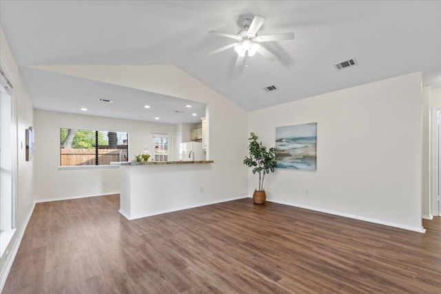 12301 Furrow Cv Unit B, Austin, TX 78753 - unfurnished living room featuring lofted ceiling, dark wood-style floors, a ceiling fan, and recessed lighting