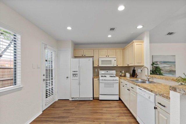 12301 Furrow Cv Unit B, Austin, TX 78753 - kitchen featuring white appliances, wood finished floors, light countertops, recessed lighting, and cream cabinets