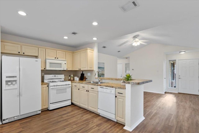 12301 Furrow Cv Unit B, Austin, TX 78753 - kitchen with white appliances, a peninsula, wood finished floors, a ceiling fan, and cream cabinetry