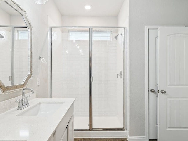 709 Bluffview Dr, Bastrop, TX 78602 - full bath with a stall shower, plenty of natural light, and vanity