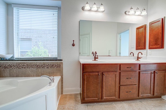 5617 Rio Chama Cv, Austin, TX 78738 - full bathroom with a garden tub, double vanity, tile patterned floors, baseboards, and a textured wall