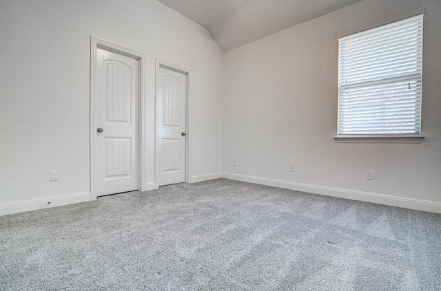 5617 Rio Chama Cv, Austin, TX 78738 - unfurnished bedroom with lofted ceiling and carpet flooring