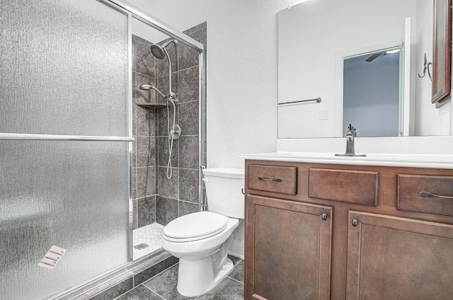 5617 Rio Chama Cv, Austin, TX 78738 - full bathroom featuring toilet, a stall shower, and vanity