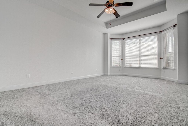 5617 Rio Chama Cv, Austin, TX 78738 - empty room featuring ceiling fan, light colored carpet, and a raised ceiling