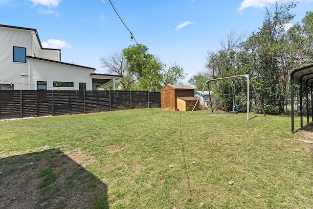 2008 Pequeno St, Austin, TX 78757 - view of yard featuring a fenced backyard, an outdoor structure, a playground, and a storage shed