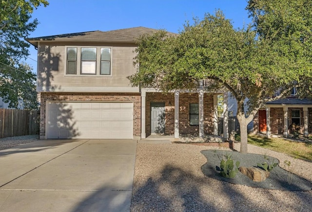 1434 Meadow Pkwy, San Marcos, TX 78666 - traditional-style home with covered porch, concrete driveway, fence, an attached garage, and brick siding