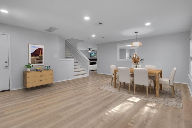 1434 Meadow Pkwy, San Marcos, TX 78666 - dining space featuring wood finished floors, recessed lighting, stairway, and visible vents