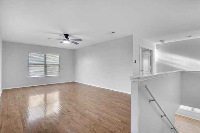 1434 Meadow Pkwy, San Marcos, TX 78666 - spare room with a ceiling fan, visible vents, baseboards, and wood finished floors
