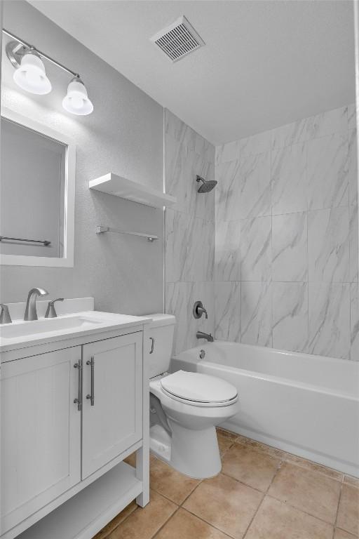 1434 Meadow Pkwy, San Marcos, TX 78666 - full bathroom with vanity, toilet, tile patterned floors, visible vents, and shower / tub combination