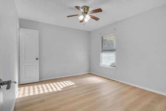 1434 Meadow Pkwy, San Marcos, TX 78666 - spare room with baseboards, ceiling fan, and light wood finished floors