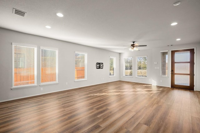 932 Azul Lagoon Dr Unit 18, Leander, TX 78641 - unfurnished living room featuring recessed lighting, wood finished floors, and a ceiling fan