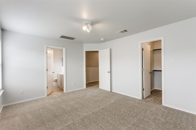 33 Verde Ranch Loop, Leander, TX 78641 - unfurnished bedroom with a spacious closet, a closet, and light colored carpet