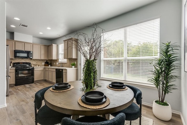33 Verde Ranch Loop, Leander, TX 78641 - dining room with recessed lighting, light wood finished floors, and baseboards