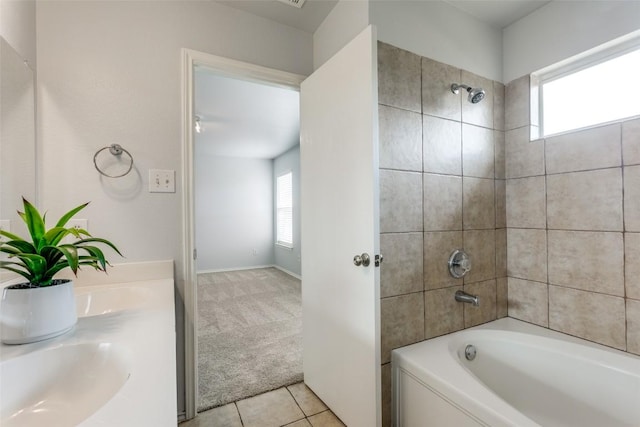 33 Verde Ranch Loop, Leander, TX 78641 - full bathroom featuring washtub / shower combination, double vanity, and tile patterned floors