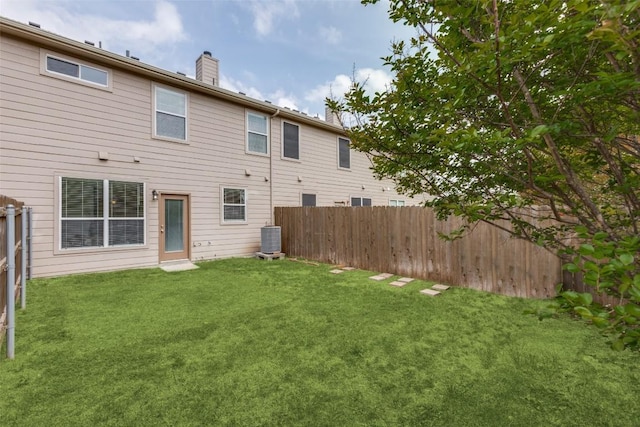 33 Verde Ranch Loop, Leander, TX 78641 - rear view of property with a chimney and central air condition unit