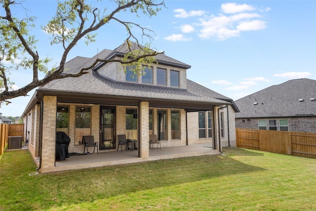 104 Trans Pecos Ct, Georgetown, TX 78628 - rear view of property with a fenced backyard, a patio, brick siding, and roof with shingles