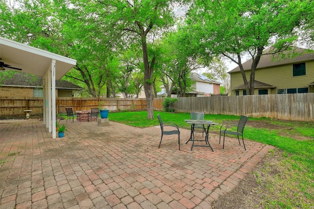 30003 Oakland Hills Dr, Georgetown, TX 78628 - fenced backyard featuring outdoor dining space, a patio area, and ceiling fan