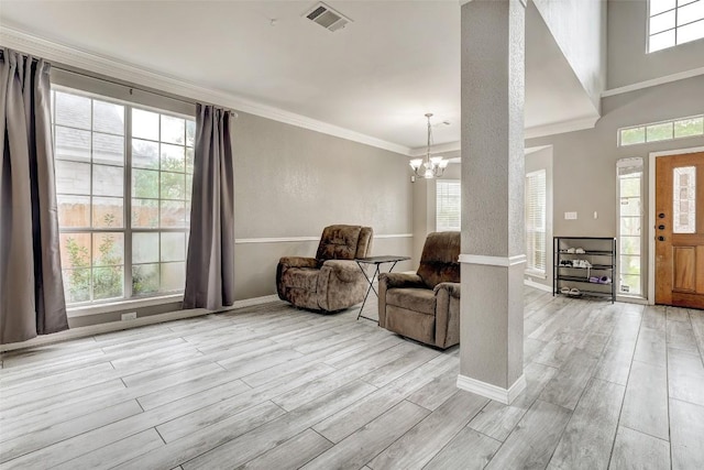 30003 Oakland Hills Dr, Georgetown, TX 78628 - entrance foyer featuring light wood-type flooring, healthy amount of natural light, a chandelier, and ornamental molding