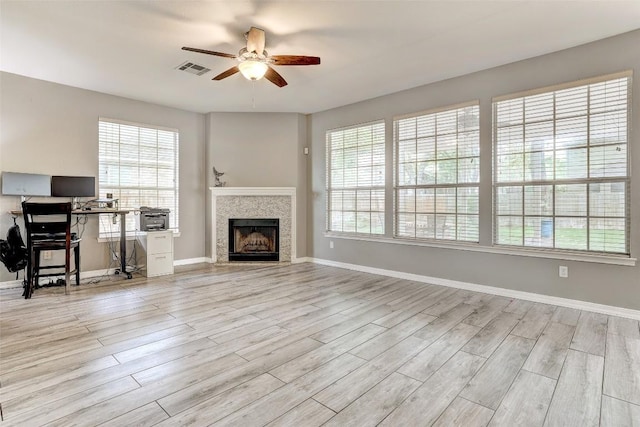 30003 Oakland Hills Dr, Georgetown, TX 78628 - living area with ceiling fan, wood finished floors, a fireplace, and an office area