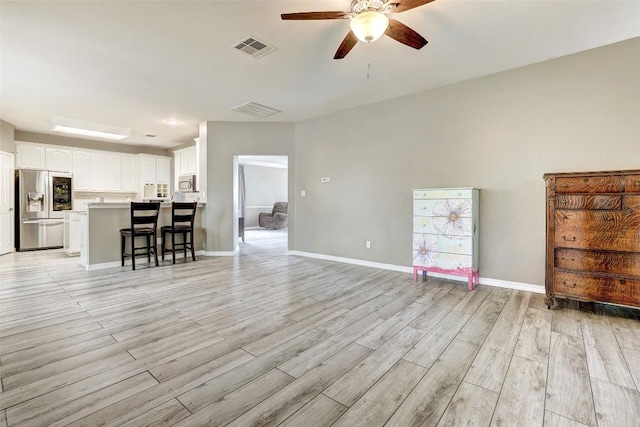 30003 Oakland Hills Dr, Georgetown, TX 78628 - living room featuring ceiling fan and light wood finished floors