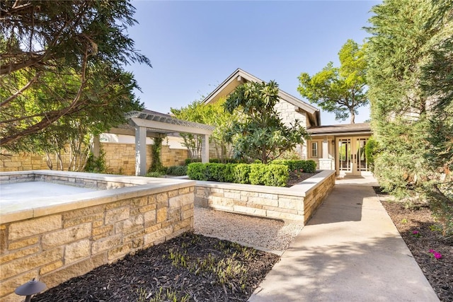 exterior space featuring french doors and fence
