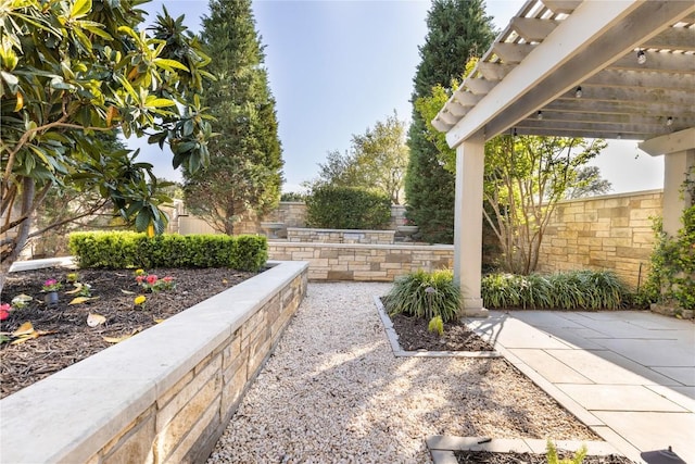 view of patio featuring a fenced backyard and a pergola