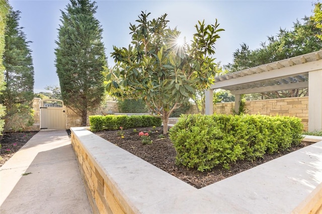 surrounding community featuring fence, a pergola, and a gate