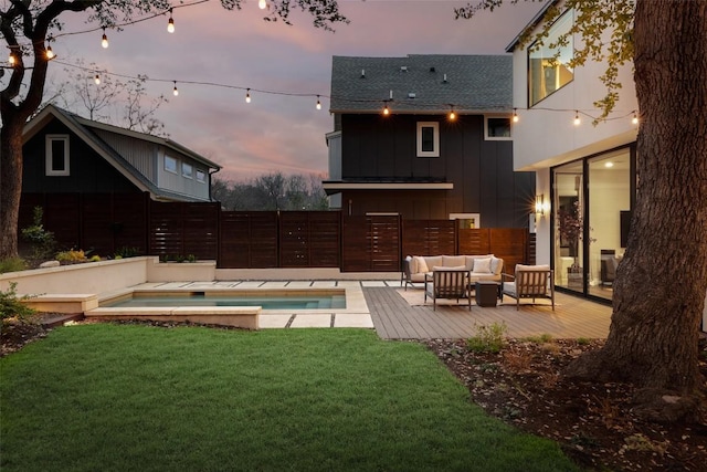 1105 W Monroe St, Austin, TX 78704 - yard at dusk with a jacuzzi, outdoor lounge area, and a deck