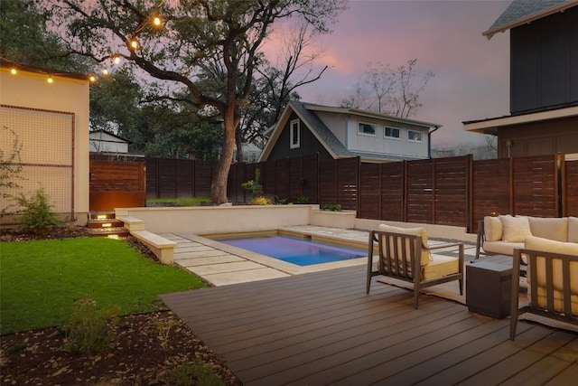 1105 W Monroe St, Austin, TX 78704 - pool at dusk with a wooden deck and outdoor lounge area