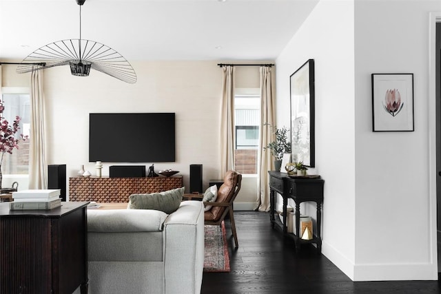 1105 W Monroe St, Austin, TX 78704 - living area with dark wood-style flooring and baseboards