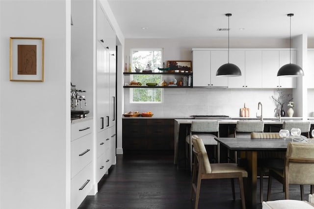 1105 W Monroe St, Austin, TX 78704 - kitchen featuring modern cabinets, backsplash, white cabinets, and light countertops