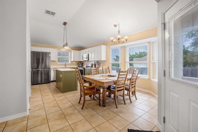 dining room featuring lofted ceiling, an inviting chandelier, visible vents, light tile patterned floors, and baseboards