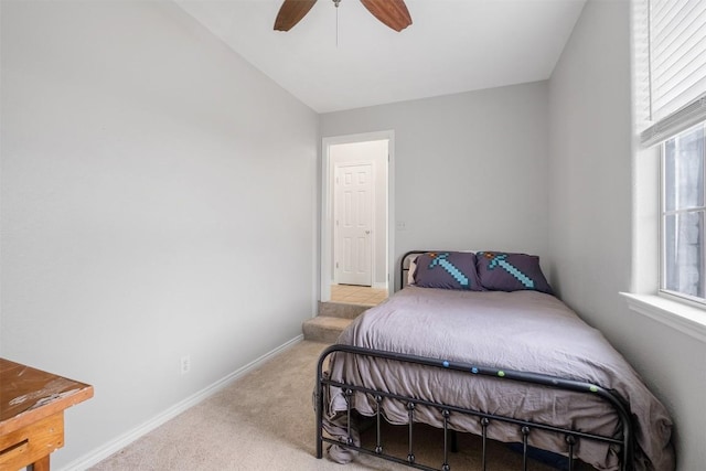 bedroom featuring ceiling fan, carpet floors, and baseboards