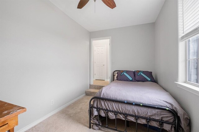 7900 Bar K Ranch Rd, Lago Vista, TX 78645 - carpeted bedroom with baseboards and a ceiling fan