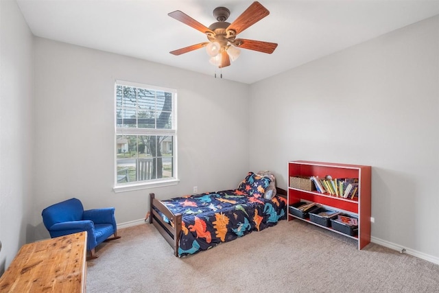 bedroom with baseboards, a ceiling fan, and carpet