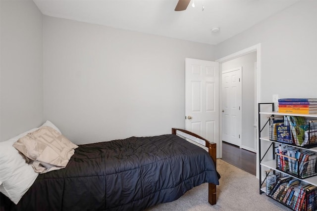 carpeted bedroom featuring ceiling fan